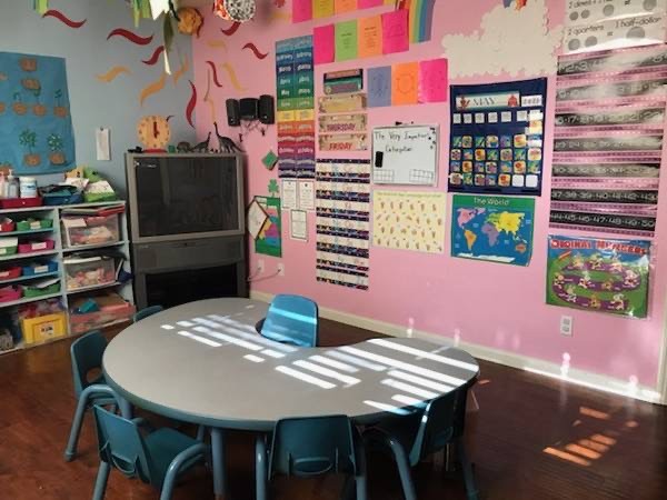 Colorful preschool classroom with a child-sized activity table